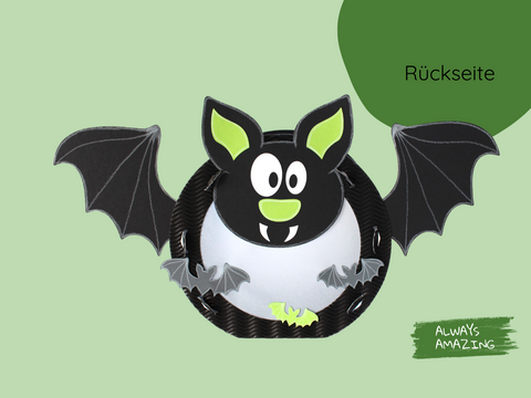 Rückseite Fledermaus-Laterne mit schwarzen Flügeln, großen Augen und grünen Details
